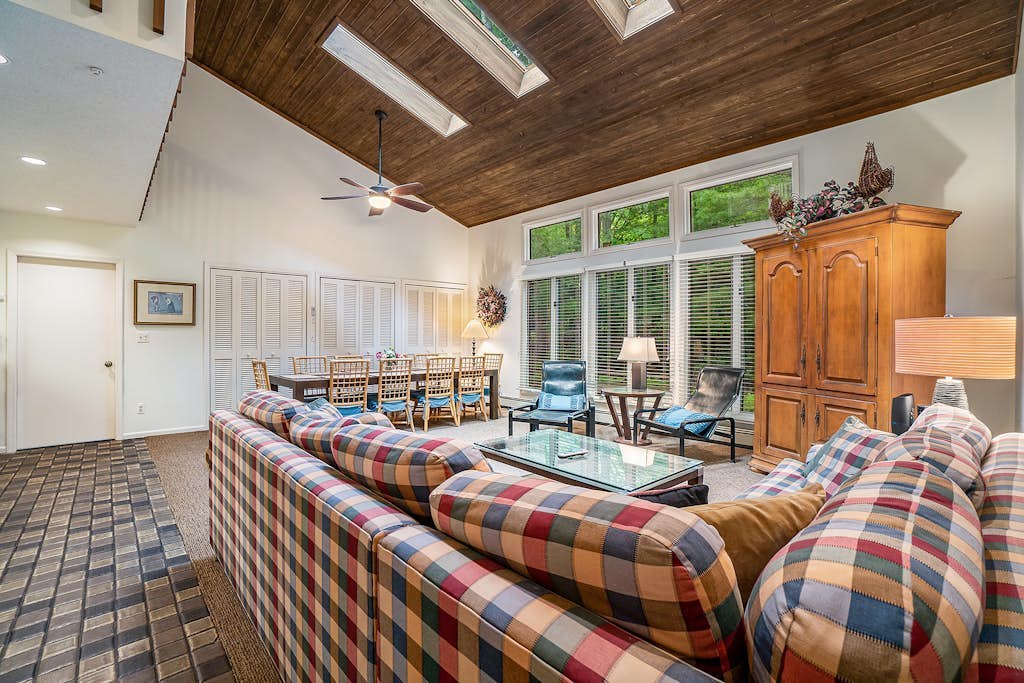 Two-story home with a patio, sunroom, balcony, & washer/dryer access