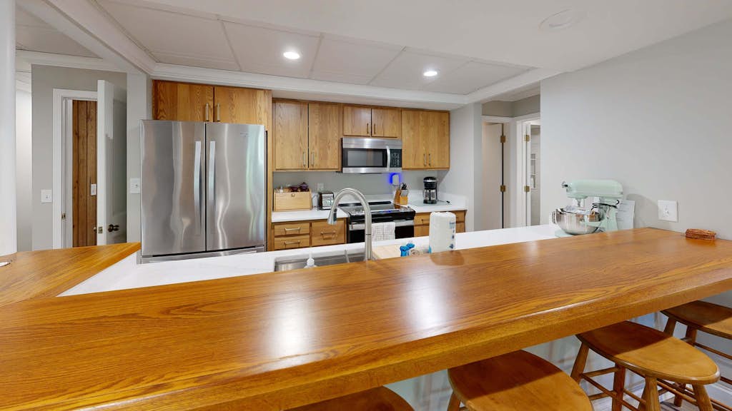Stylish retreat with a full kitchen, sunroom, & W/D access