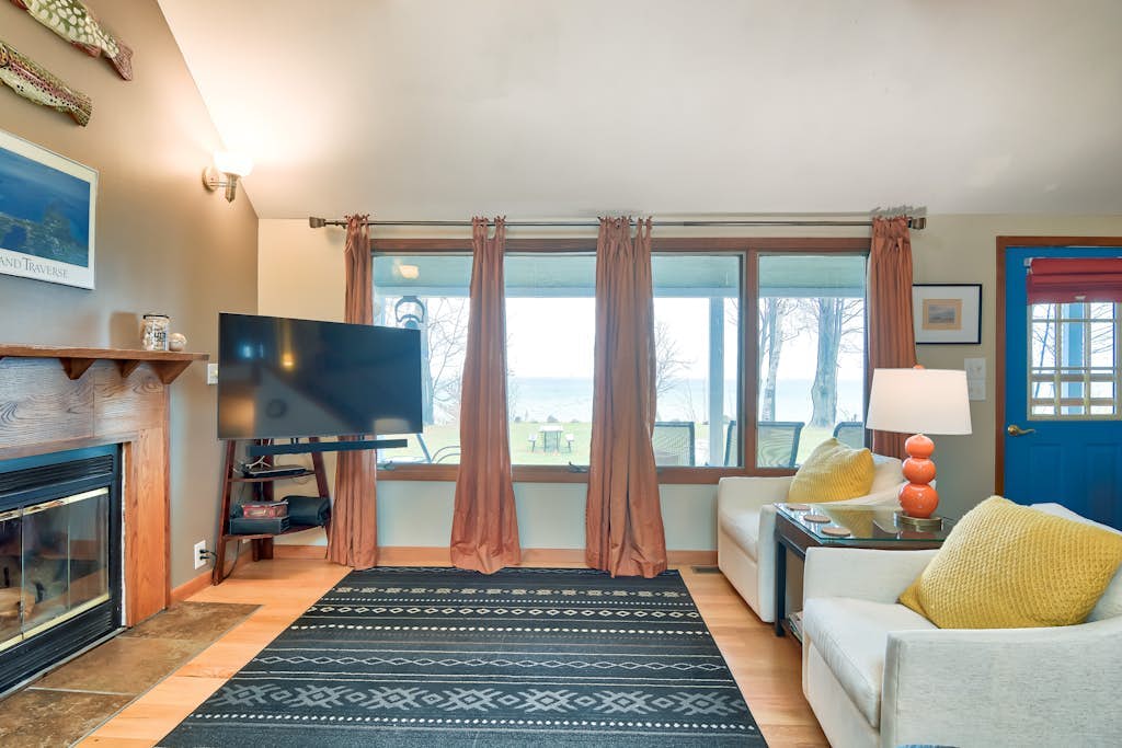 Dog-friendly secluded home near Suttons Bay with water views, firepit, fireplace