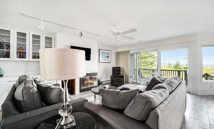 Lower-level beachfront condo with deck, lake views, washer/dryer, fireplace