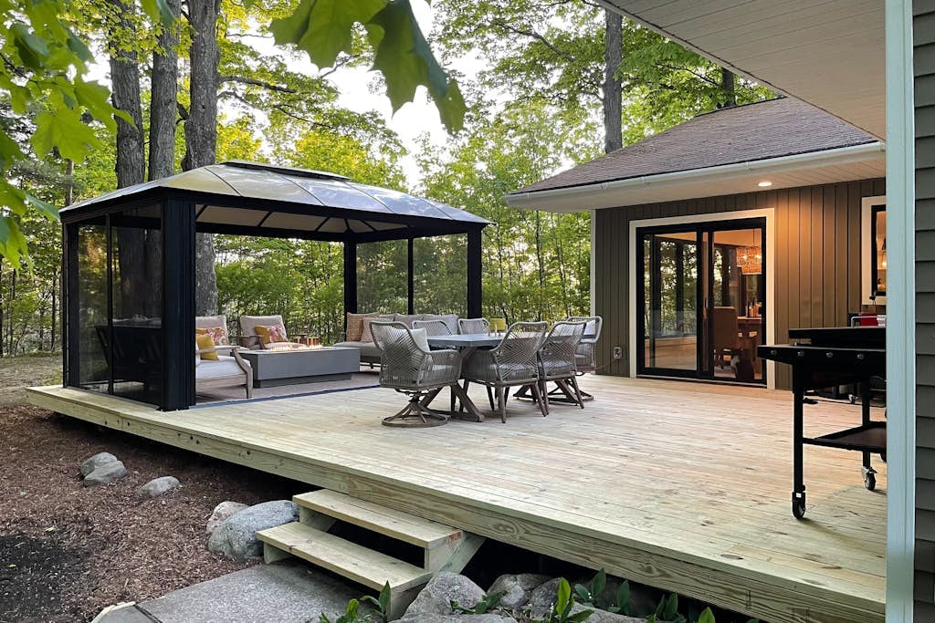 Modern Home in the woods w/ a large patio, gas grill, & near the lake