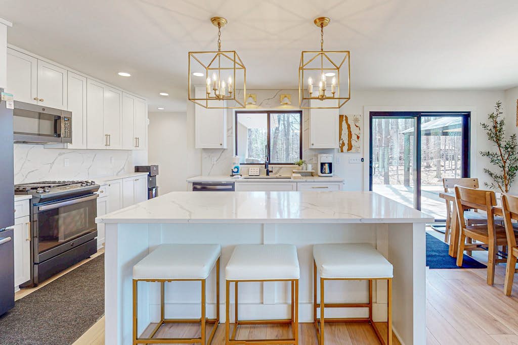 Modern Home in the woods w/ a large patio, gas grill, & near the lake