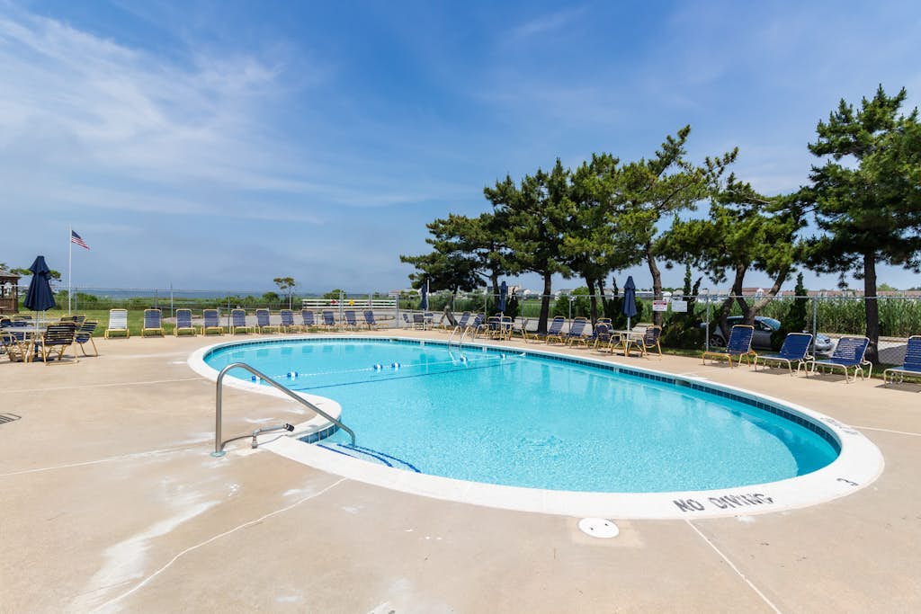 Updated coastal getaway with pool - walk to beach, dining, shops & entertainment