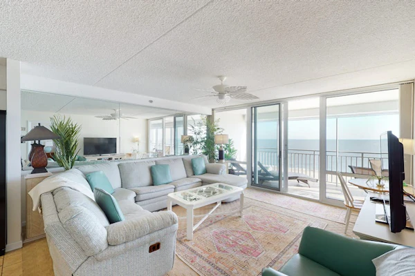 Convenient beachfront condo with balcony, pools, sauna, gym, AC, & game room