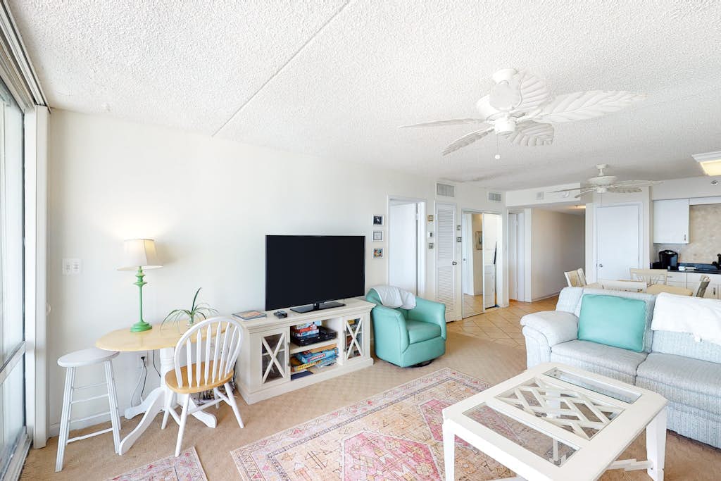 Convenient beachfront condo with balcony, pools, sauna, gym, AC, & game room