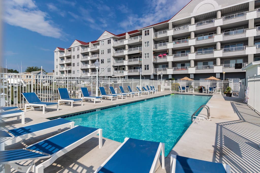 Bayfront condo with marina views and access to shared pool - walk to beach