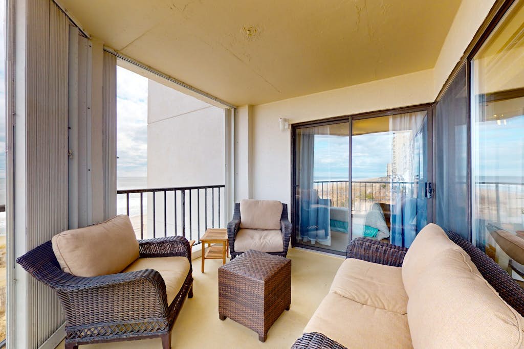 Corner unit ocean view condo with large balcony, direct beach access, & W/D
