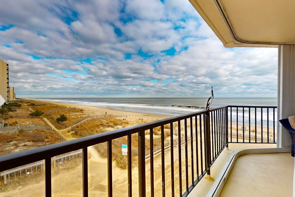 Corner unit ocean view condo with large balcony, direct beach access, & W/D