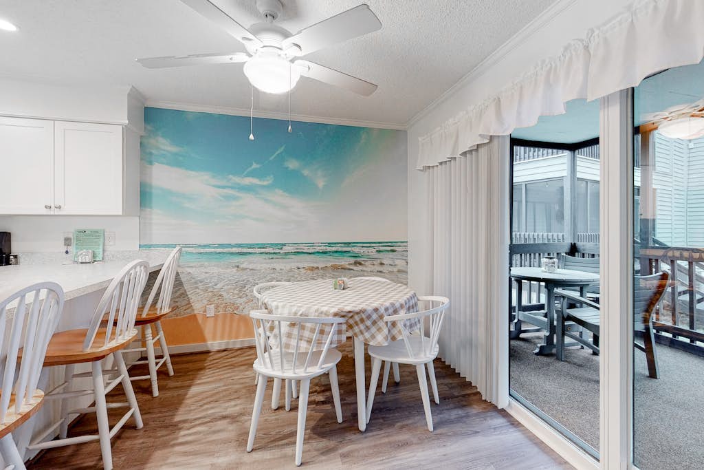 1st-Floor End Condo w/Free WiFi, Screened Porch, Central AC, Shared Outdoor Pool