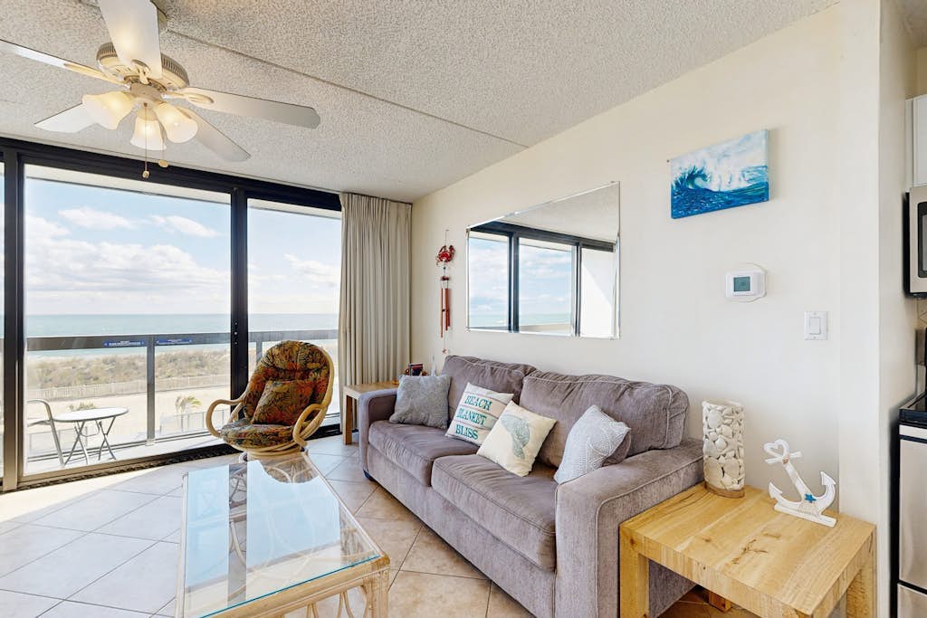 Convenient & affordable beach condo with AC, W/D, pools, gym & game room