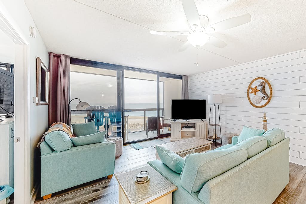 Remodeled condo with beach views, balcony, pools, gym, tennis & AC