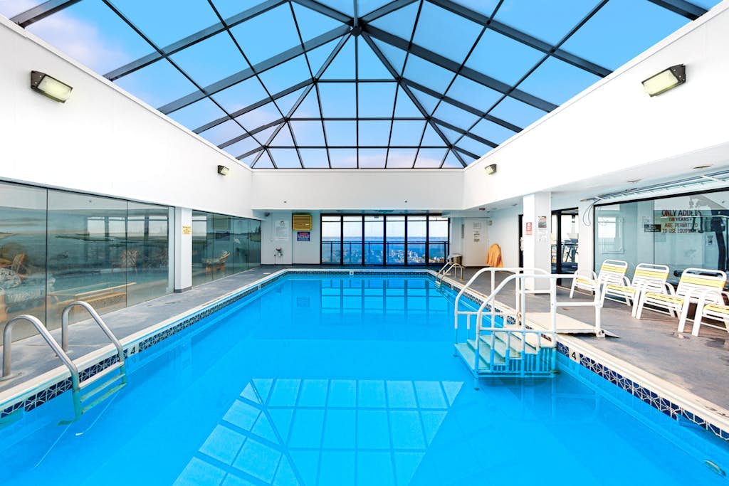 Incredible beachfront condo with balcony, pools, gym & tennis