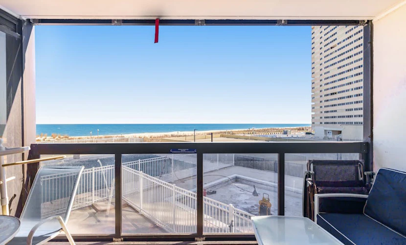 Convenient & affordable condo with angled ocean views, pools & gym