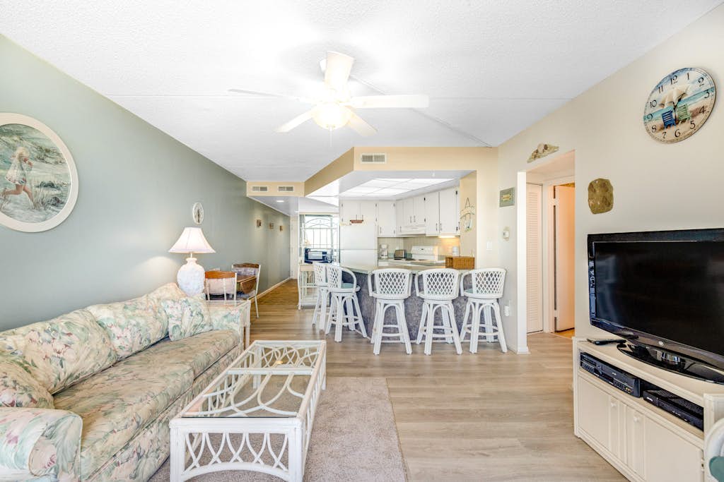 Convenient & affordable condo with angled ocean views, pools & gym