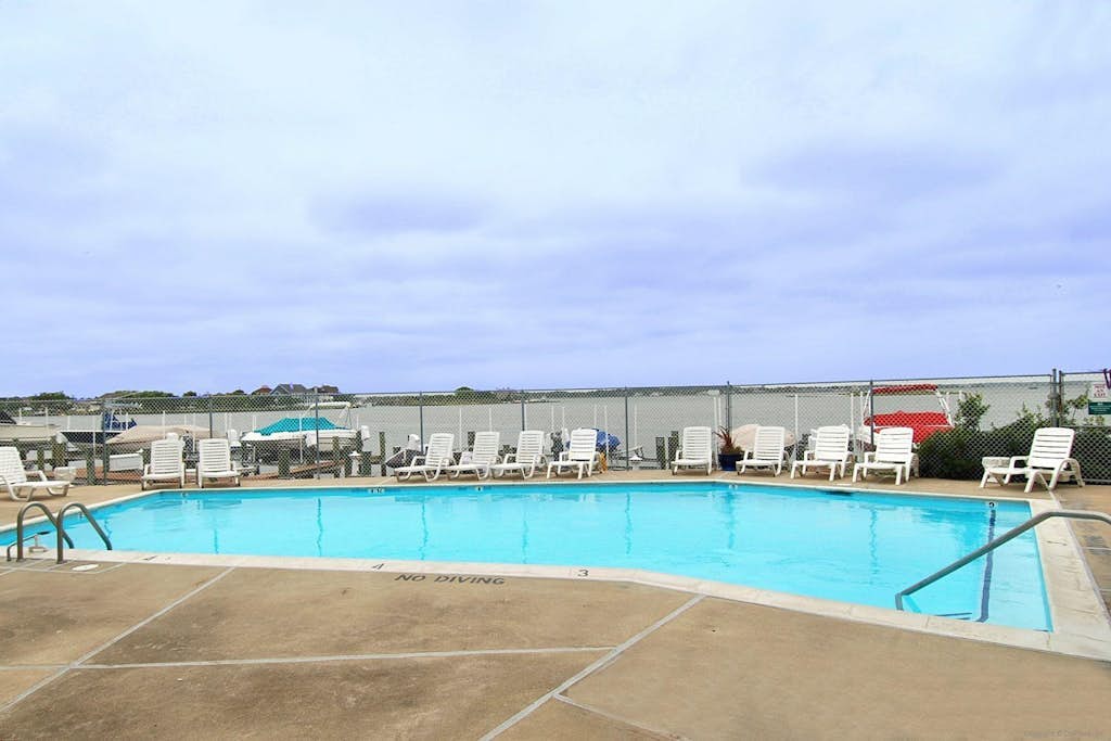 Wonderful bayfront condo overlooking the marina with pool, balcony & fireplace