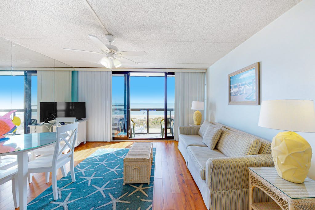 Joyful beachfront condo with balcony, pools, gym, game room & AC