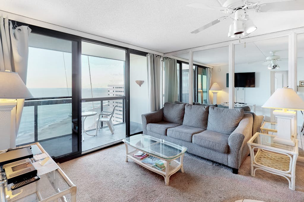 Beachfront condo with balcony, AC, pools, gym & sauna