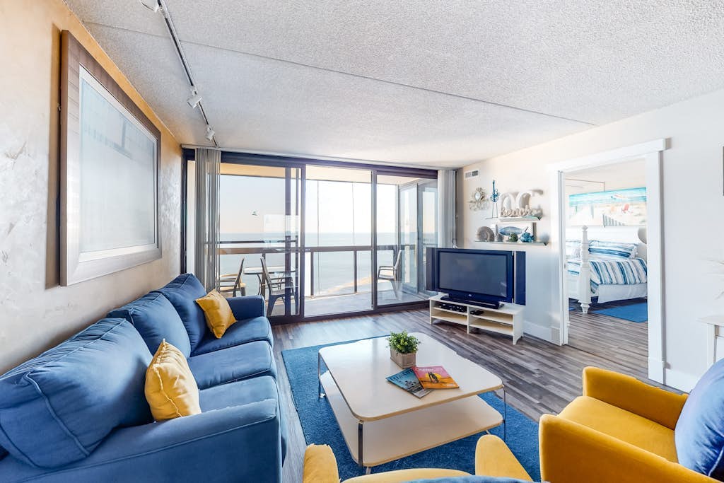 Affordable beachfront condo with balcony, W/D, AC, pools & game room