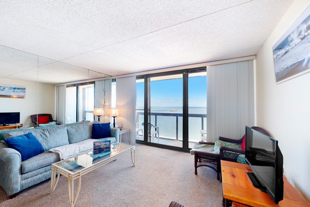 Incredible beachfront condo with balcony, washer/dryer, pools & gym