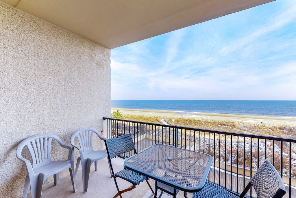Oceanfront condo with balcony, AC, pool, & W/D