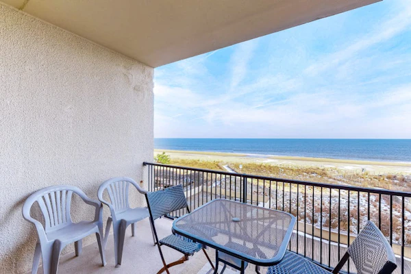 Oceanfront condo with balcony, AC, pool, & W/D