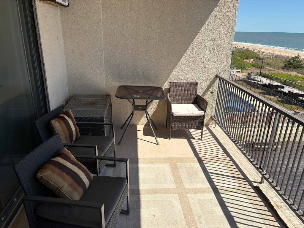 Oceanfront condo with balcony, AC, pool, & W/D
