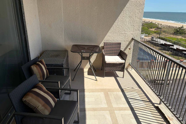 Oceanfront condo with balcony, AC, pool, & W/D