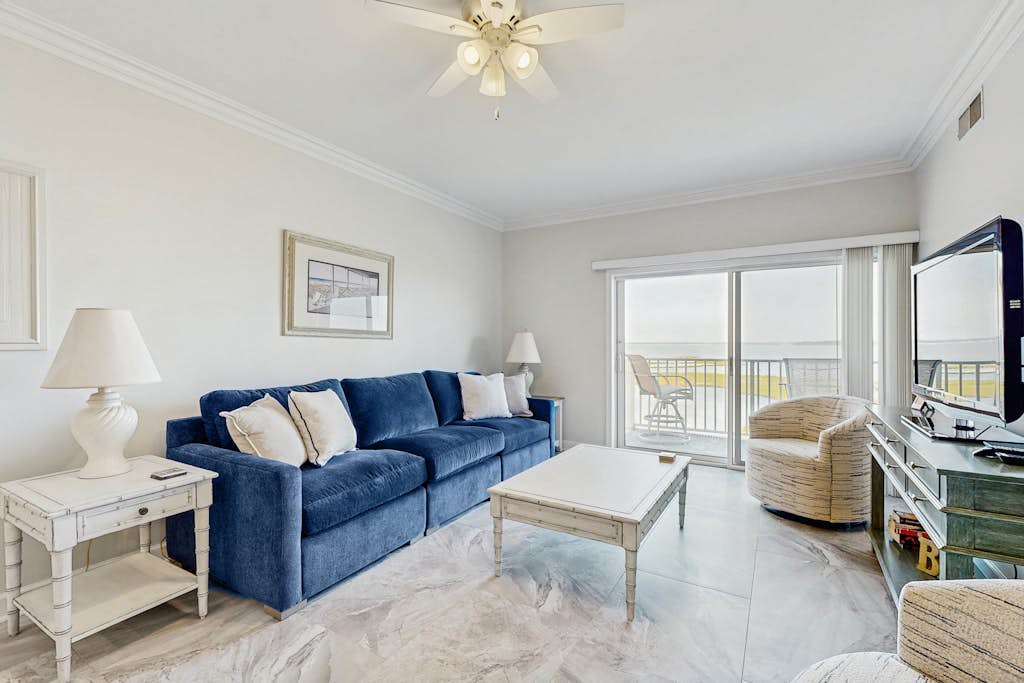 Ideal fourth-floor condo with bay views from living room/balcony & pool