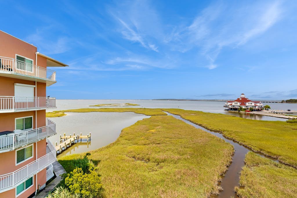 Ideal fourth-floor condo with bay views from living room/balcony & pool