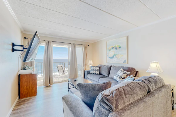 Sun-filled beach front condo w/ocean views balcony, W/D, hot tub, & full kitchen
