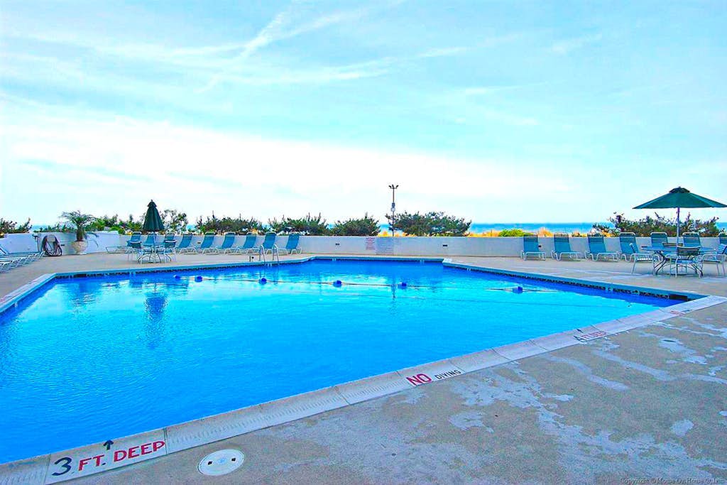 Up-to-Date, Oceanfront Condo with Balcony, AC, WiFi, Laundry & Shared Pool