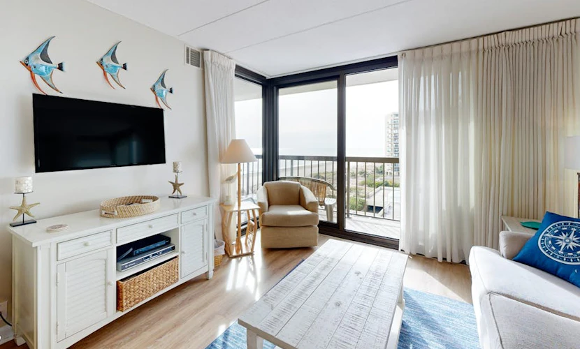 Bright, ocean-view condo with balcony, AC, pools, saunas & gym