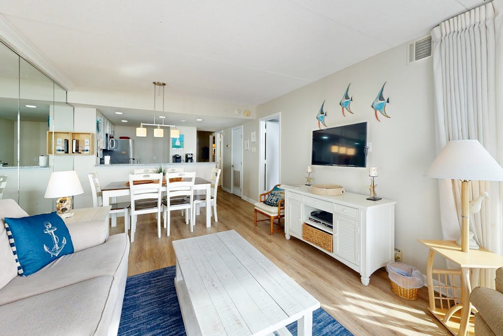 Bright, ocean-view condo with balcony, AC, pools, saunas & gym