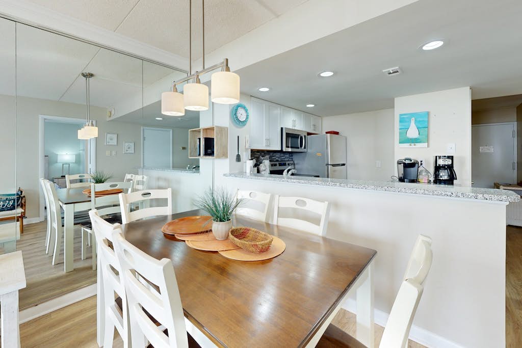 Bright, ocean-view condo with balcony, AC, pools, saunas & gym