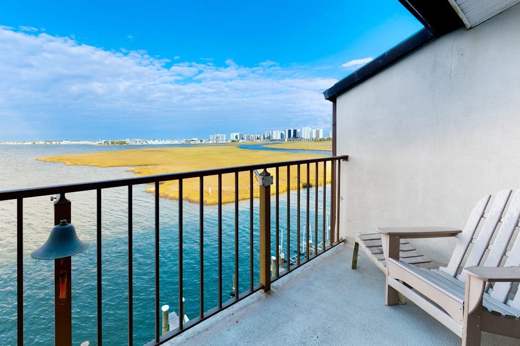 Two-Level Bayfront Condo with Amazing Sunsets, Balcony, WiFi & Shared Pool