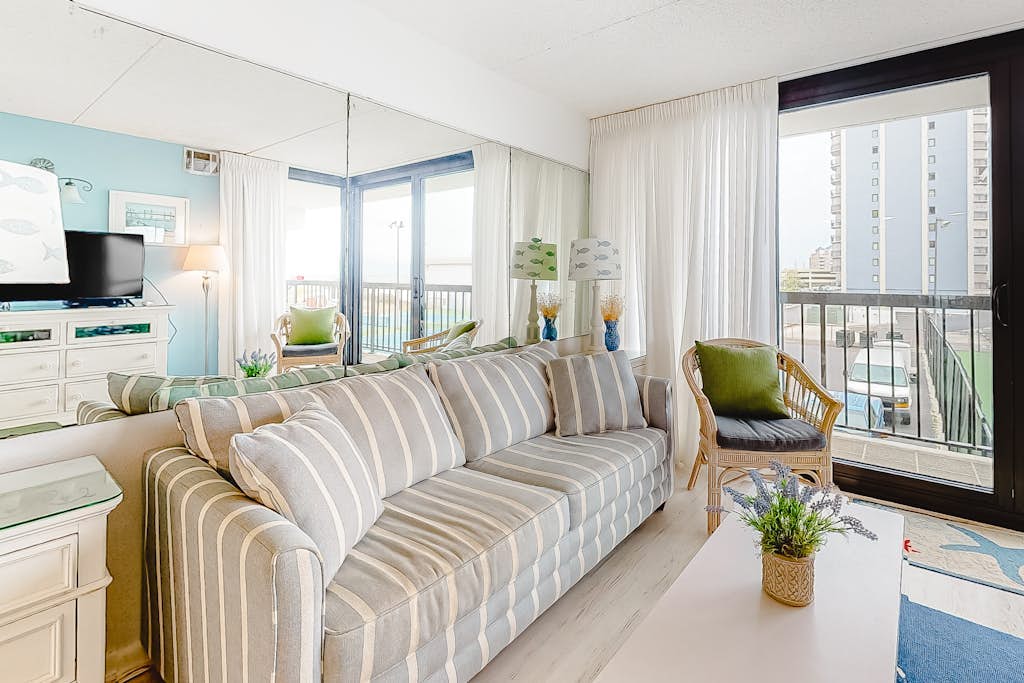 Incredible condo with tennis court views, balcony, pools, game room & gym