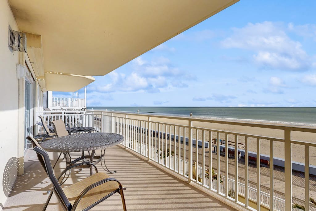 Lovely beachfront condo with ocean view, pool, balcony, fireplace, AC, & W/D
