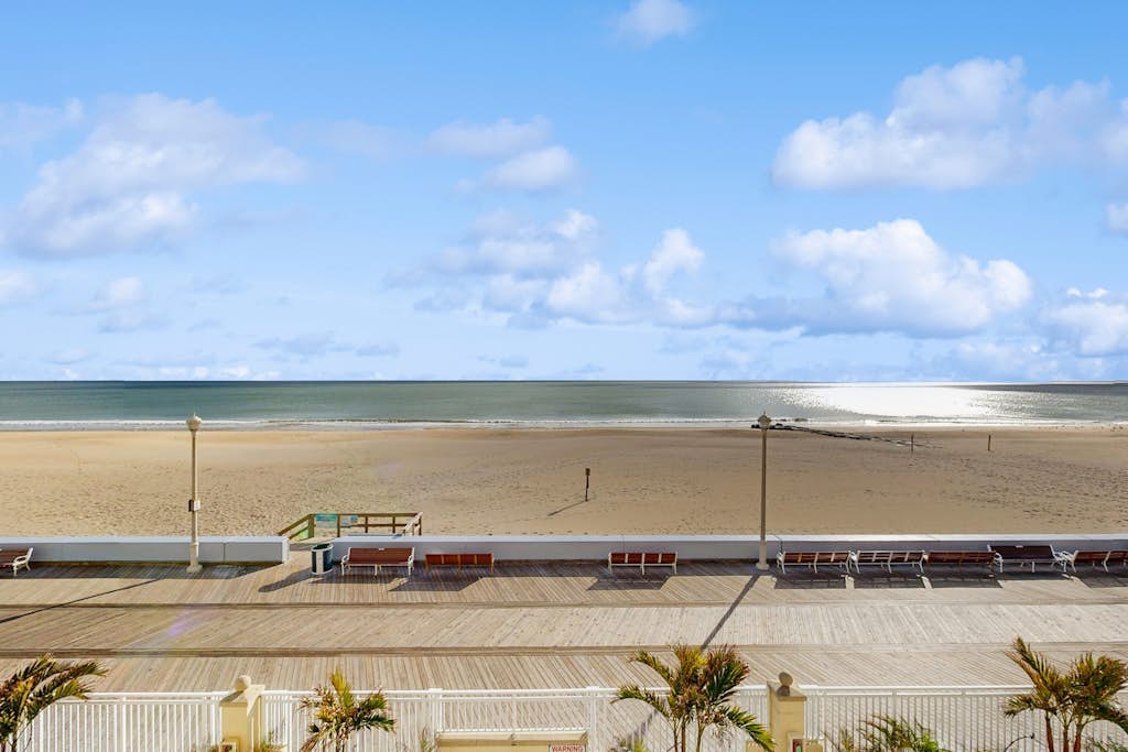 Lovely beachfront condo with ocean view, pool, balcony, fireplace, AC, & W/D