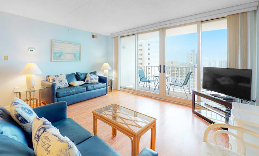 Convenient condo with side ocean views, balcony, pools, & tennis