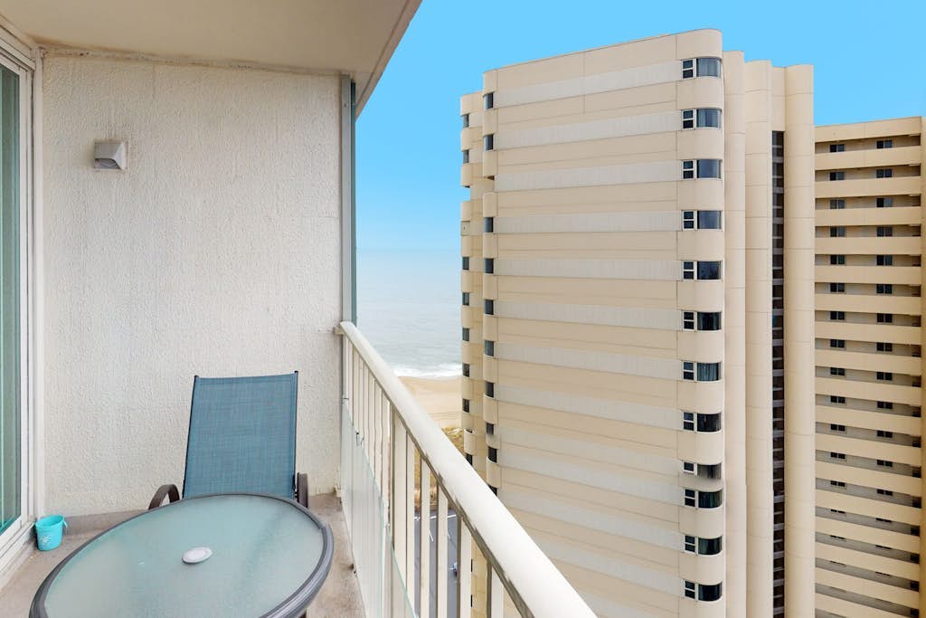 Convenient condo with side ocean views, balcony, pools, & tennis