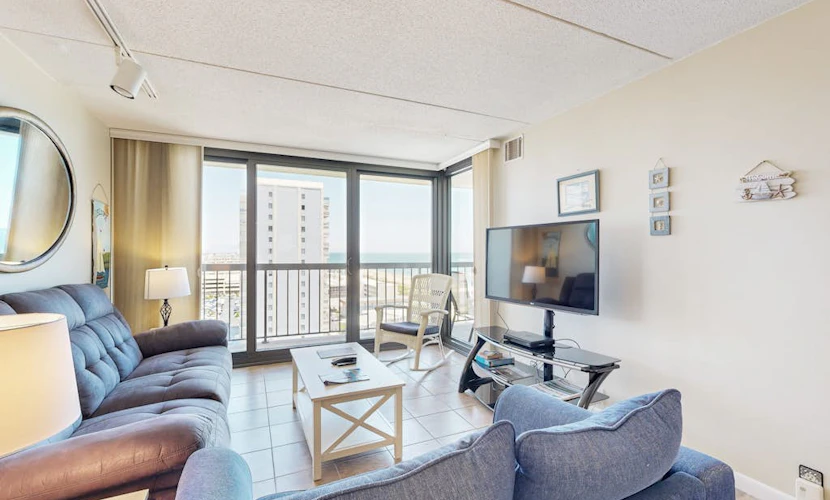 Beach condo with balcony, W/D, pools, game room, tennis & gym