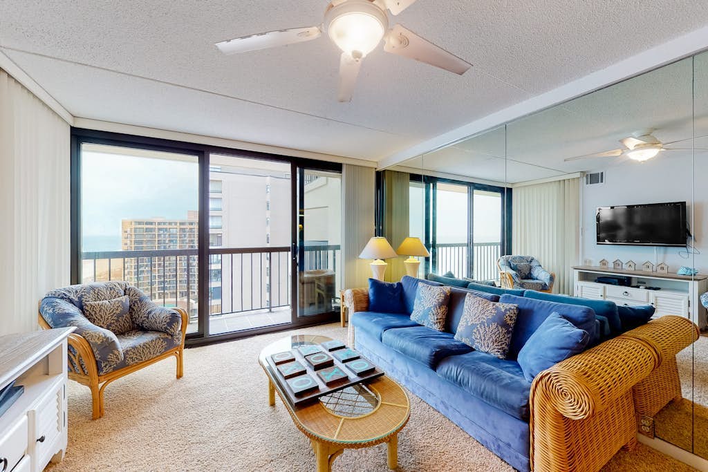 Breezy inviting condo with balcony, pools, gym, game room & tennis