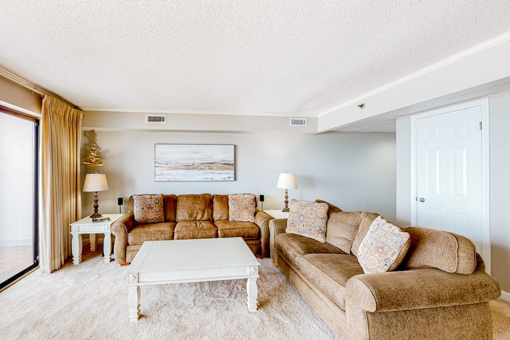 Beachfront condo with ocean views, private balcony, central AC, & W/D