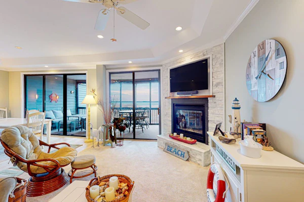 Coastal condo with breathtaking views, balcony, fireplace, & W/D - pool access