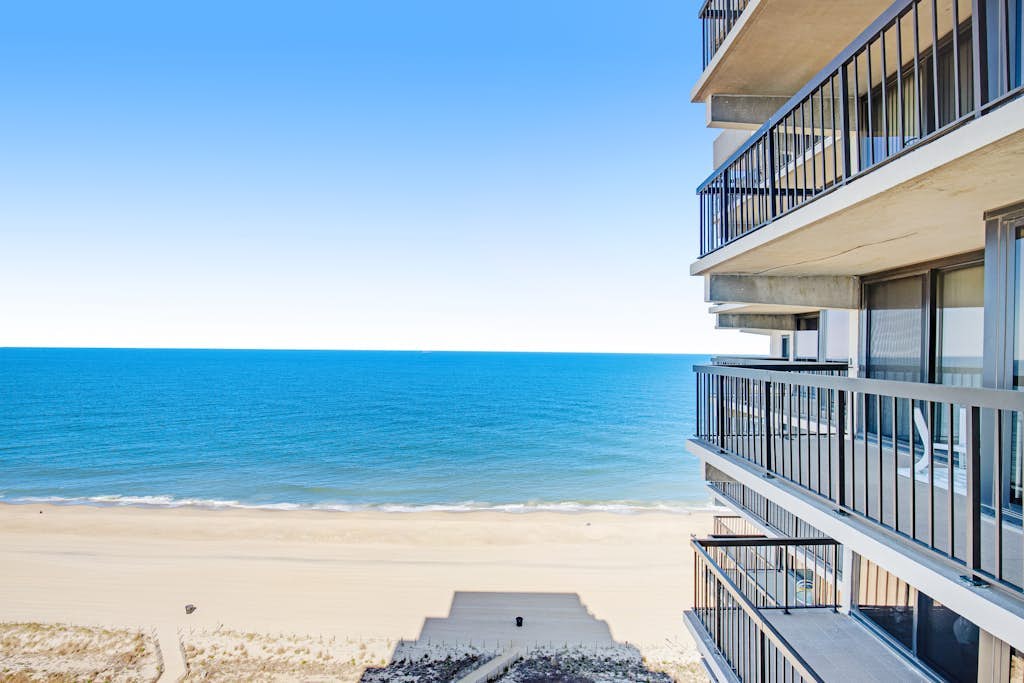 Sun-kissed beach condo with balcony, pools, game room, tennis & AC