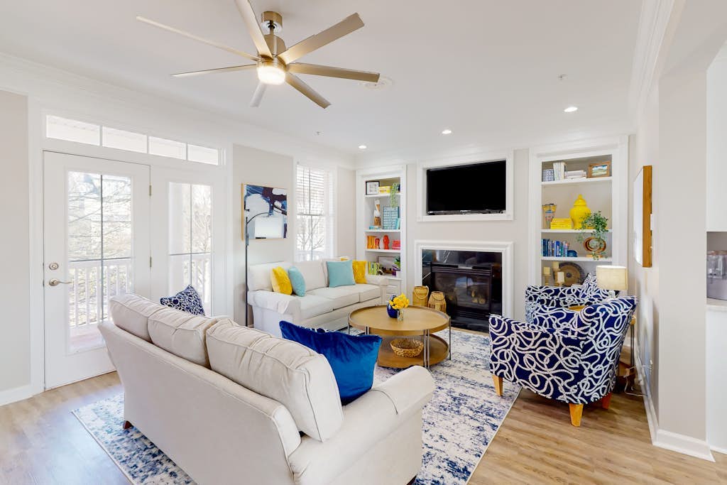 Waterfront house with a gas fireplace, washer/dryer, pools, dock, & gym