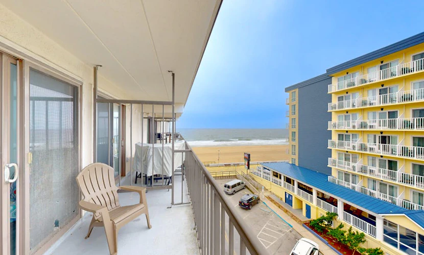 Boardwalk condo with ocean view, pool, direct beach access, balcony & W/D