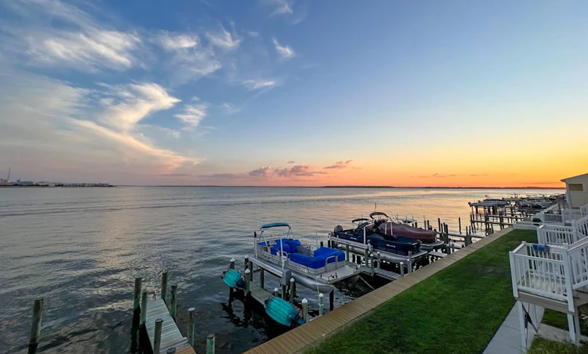 Waterfront stay with dock and pool access, washer/dryer, beach gear, & AC