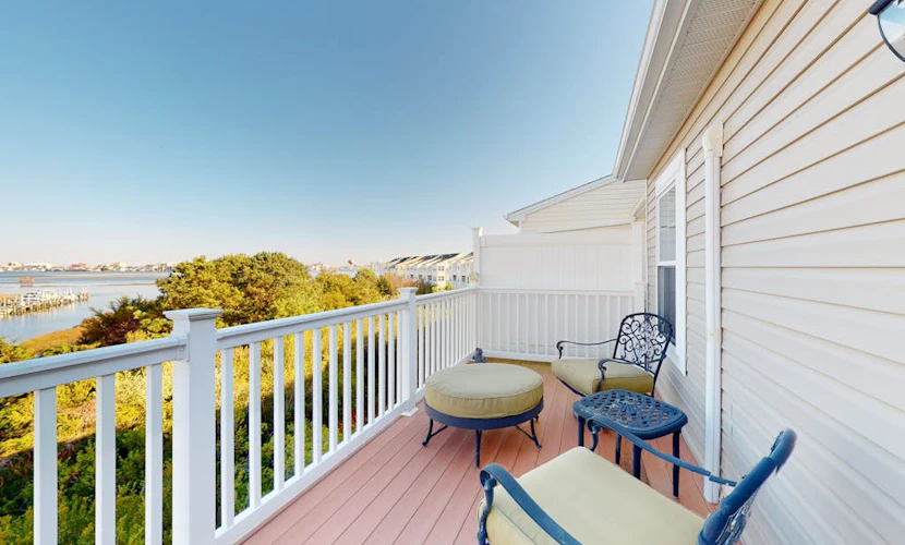 Bay-view townhome with pool & private outdoor living - walk to dining