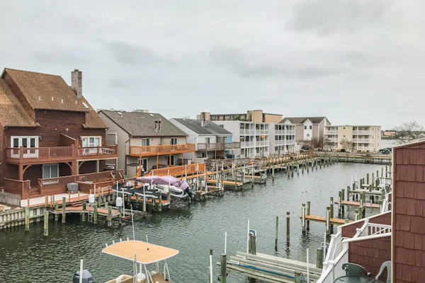 Canal-front townhome with front/back decks, shared pool, private w/d, & WiFi